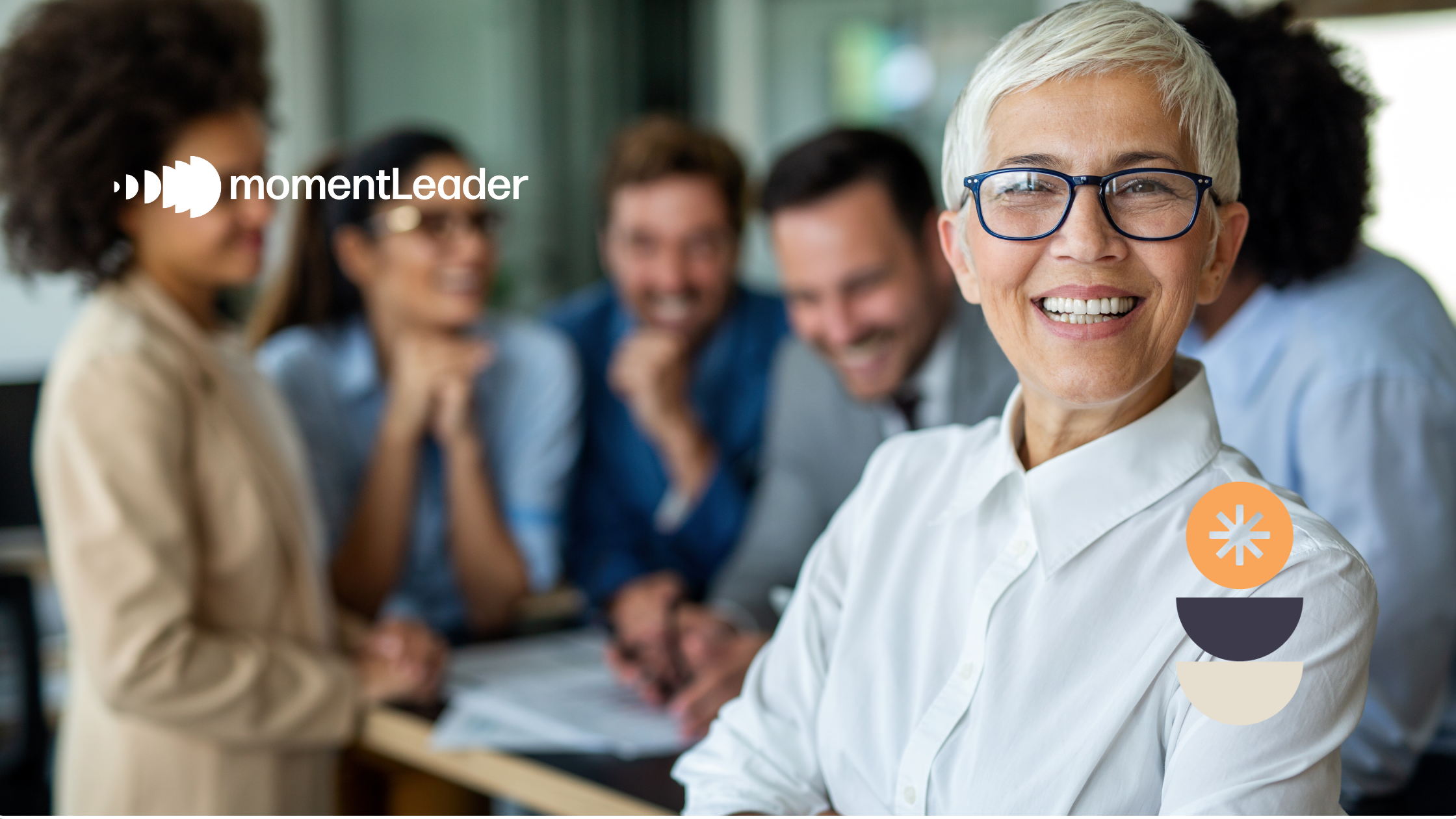 Women proudly smiling with her team of colleagues behind her